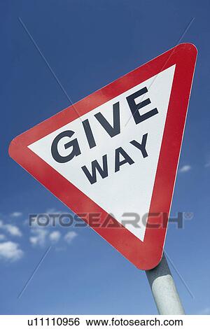 Stock Photograph - Give Way Sign Against A Blue Sky. Fotosearch