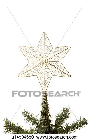Stock Image - Gold Star On Top Of Christmas Tree Against White Background. Fotosearch