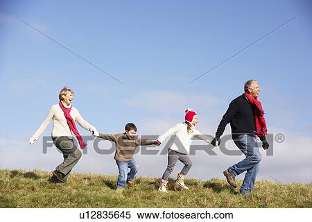 Grandparents And Grandchildren Running In The Park View Large Photo Image Stock Photography - Grandparents And Grandchildren Running In The Park. Fotosearch