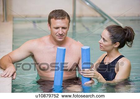 Instructor And Patient Undergoing Water Therapy View Large Photo Image Stock Image - Instructor And Patient Undergoing Water Therapy. Fotosearch