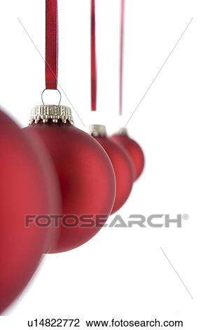 Line Of Red Christmas Decorations Hanging Against White Background View Large Photo Image Stock Image - Line Of Red Christmas Decorations Hanging Against White Background. Fotosearch