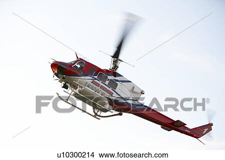 Low angle view of Medevac helicopter in flight View Large Photo Image Picture - Low angle view of Medevac helicopter in flight. Fotosearch