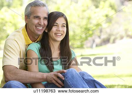 Stock Image - Man And His Teenage Daughter. Fotosearch