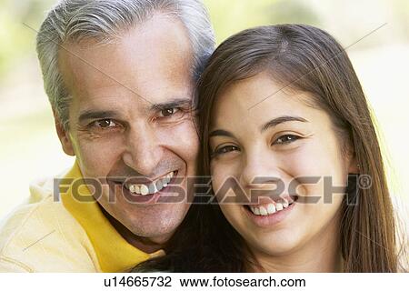 Stock Image - Man And His Teenage Daughter. Fotosearch