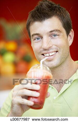 Man Drinking A Berry Smoothie View Large Photo Image Stock Photo - Man Drinking A Berry Smoothie. Fotosearch
