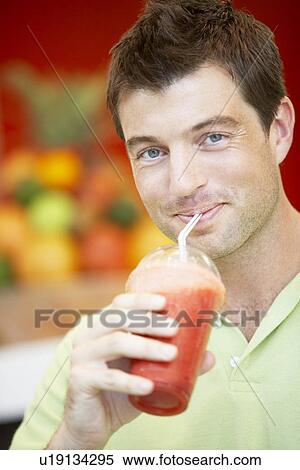 Man Drinking A Berry Smoothie View Large Photo Image Stock Photography - Man Drinking A Berry Smoothie. Fotosearch