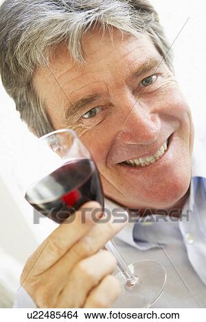 Picture - Man Drinking A Glass Of Red Wine. Fotosearch