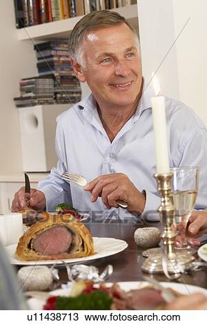 Man Eating Dinner At Home View Large Photo Image Stock Image - Man Eating Dinner At Home. Fotosearch