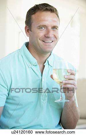 Man Enjoying A Glass Of White Wine View Large Photo Image Stock Image - Man Enjoying A Glass Of White Wine. Fotosearch