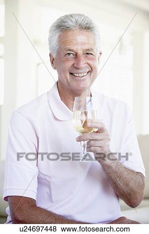 Man Enjoying A Glass Of White Wine View Large Photo Image Stock Photo - Man Enjoying A Glass Of White Wine. Fotosearch