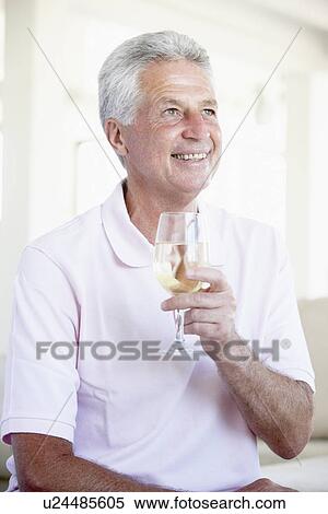 Man Enjoying A Glass Of White Wine View Large Photo Image Stock Photography - Man Enjoying A Glass Of White Wine. Fotosearch