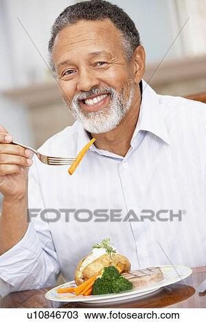 Man Enjoying A Meal At Home View Large Photo Image Stock Image - Man Enjoying A Meal At Home. Fotosearch