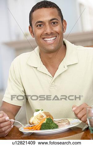Man Enjoying A Meal At Home View Large Photo Image Stock Photo - Man Enjoying A Meal At Home. Fotosearch