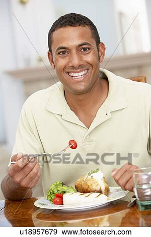 Man Enjoying A Meal At Home View Large Photo Image Stock Photo - Man Enjoying A Meal At Home. Fotosearch