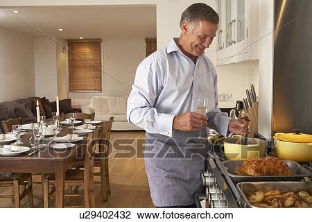 Man Preparing Food For A Dinner Party View Large Photo Image Stock Image - Man Preparing Food For A Dinner Party. Fotosearch
