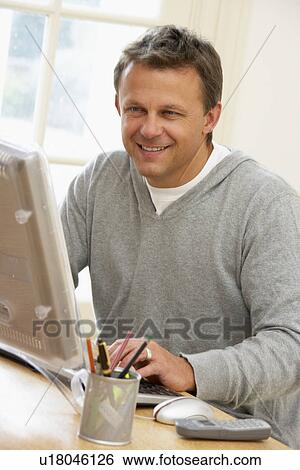 Stock Photograph - Man Using Computer. Fotosearch