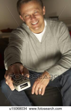 Man Using Television Remote Control View Large Photo Image Picture - Man Using Television Remote Control. Fotosearch