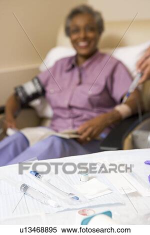 Medical Equipment On A Table With A Patient In The Background View Large Photo Image Stock Photography - Medical Equipment On A Table With A Patient In The Background. Fotosearch