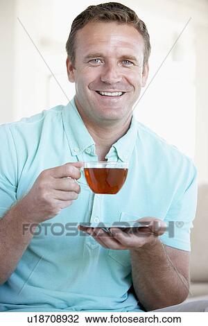 Mid Adult Man Drinking Tea View Large Photo Image Stock Image - Mid Adult Man Drinking Tea. Fotosearch