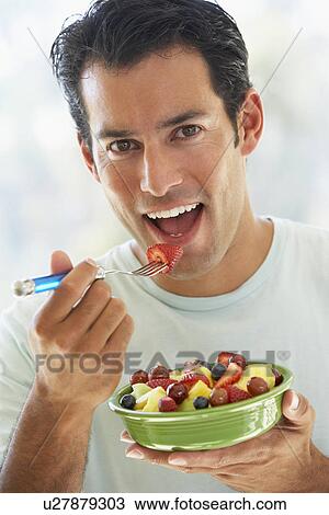 Mid Adult Man Eating Fresh Fruit Salad View Large Photo Image Stock Image - Mid Adult Man Eating Fresh Fruit Salad. Fotosearch