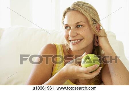 Mid Adult Woman Eating A Healthy Apple View Large Photo Image Stock Image - Mid Adult Woman Eating A Healthy Apple. Fotosearch