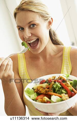 Mid Adult Woman Eating A Healthy Salad View Large Photo Image Picture - Mid Adult Woman Eating A Healthy Salad. Fotosearch