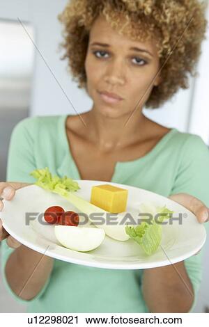 Mid Adult Woman Holding A Plate Of Healthy Food View Large Photo Image Stock Image - Mid Adult Woman Holding A Plate Of Healthy Food. Fotosearch