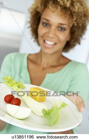 Mid Adult Woman Holding A Plate Of Healthy Food View Large Photo Image Stock Photograph - Mid Adult Woman Holding A Plate Of Healthy Food. Fotosearch