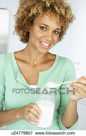 Mid Adult Woman Holding Dietary Supplements View Large Photo Image Stock Photo - Mid Adult Woman Holding Dietary Supplements. Fotosearch