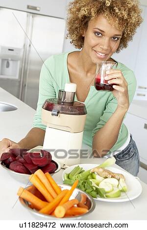 Mid Adult Woman Making Fresh Vegetable Juice View Large Photo Image Stock Image - Mid Adult Woman Making Fresh Vegetable Juice. Fotosearch