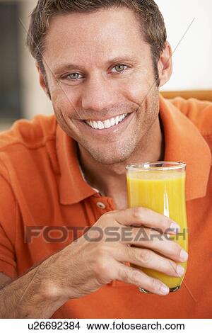 Middle Aged Man Drinking Fresh Orange Juice View Large Photo Image Picture - Middle Aged Man Drinking Fresh Orange Juice. Fotosearch