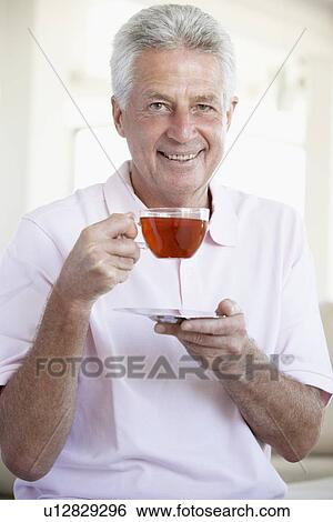 Middle Aged Man Drinking Tea View Large Photo Image Stock Photograph - Middle Aged Man Drinking Tea. Fotosearch