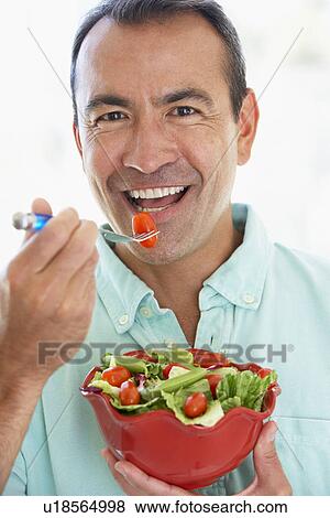 Middle Aged Man Eating A Fresh Green Salad View Large Photo Image Stock Photo - Middle Aged Man Eating A Fresh Green Salad. Fotosearch