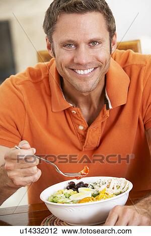 Middle Aged Man Eating A Healthy Meal, Smiling At The Camera View Large Photo Image Stock Image - Middle Aged Man Eating A Healthy Meal, Smiling At The Camera. Fotosearch