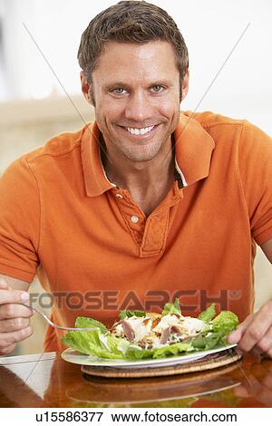 Middle Aged Man Eating A Healthy Meal View Large Photo Image Stock Photo - Middle Aged Man Eating A Healthy Meal. Fotosearch