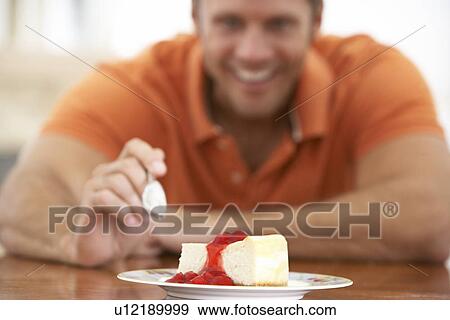 Middle Aged Man Eating Cheesecake View Large Photo Image Stock Photo - Middle Aged Man Eating Cheesecake. Fotosearch