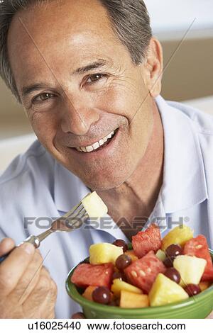 Middle Aged Man Eating Fresh Fruit Salad View Large Photo Image Stock Image - Middle Aged Man Eating Fresh Fruit Salad. Fotosearch