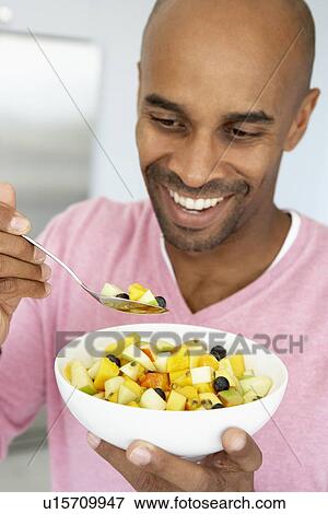 Middle Aged Man Eating Fresh Fruit Salad View Large Photo Image Stock Photo - Middle Aged Man Eating Fresh Fruit Salad. Fotosearch