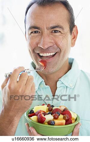 Middle Aged Man Eating Fresh Fruit Salad View Large Photo Image Stock Photograph - Middle Aged Man Eating Fresh Fruit Salad. Fotosearch
