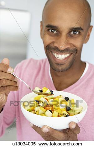 Middle Aged Man Eating Fresh Fruit Salad View Large Photo Image Stock Photography - Middle Aged Man Eating Fresh Fruit Salad. Fotosearch