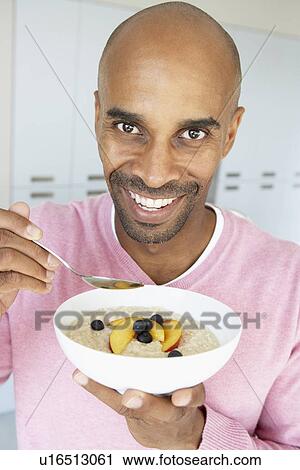 Middle Aged Man Eating Healthy Breakfast View Large Photo Image Stock Image - Middle Aged Man Eating Healthy Breakfast. Fotosearch