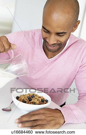 Middle Aged Man Eating Healthy Breakfast View Large Photo Image Stock Image - Middle Aged Man Eating Healthy Breakfast. Fotosearch