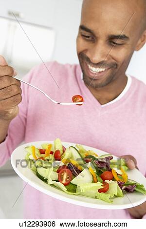 Middle Aged Man Eating Healthy Salad View Large Photo Image Stock Photograph - Middle Aged Man Eating Healthy Salad. Fotosearch