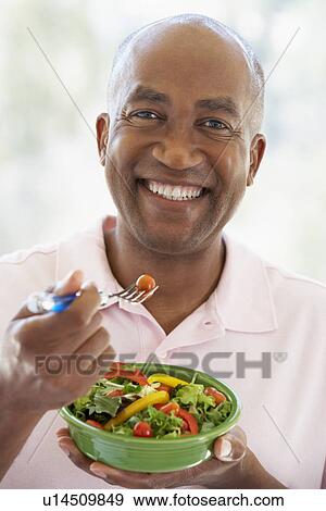 Middle Aged Man Eating Salad View Large Photo Image Stock Photo - Middle Aged Man Eating Salad. Fotosearch