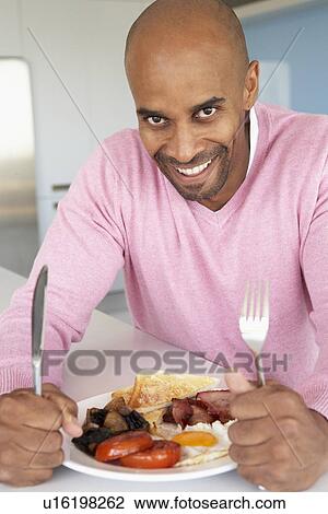 Middle Aged Man Eating Unhealthy Fried Breakfast View Large Photo Image Stock Image - Middle Aged Man Eating Unhealthy Fried Breakfast. Fotosearch