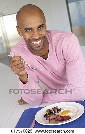 Middle Aged Man Eating Unhealthy Fried Breakfast View Large Photo Image Stock Image - Middle Aged Man Eating Unhealthy Fried Breakfast. Fotosearch