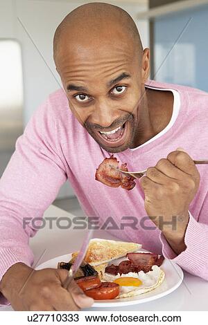 Middle Aged Man Eating Unhealthy Fried Breakfast View Large Photo Image Stock Image - Middle Aged Man Eating Unhealthy Fried Breakfast. Fotosearch