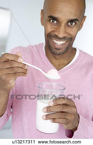 Middle Aged Man Holding Dietary Supplements View Large Photo Image Stock Image - Middle Aged Man Holding Dietary Supplements. Fotosearch