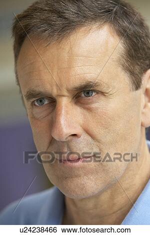 Stock Photograph - Middle Aged Man In Contemplation. Fotosearch