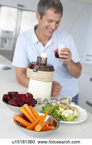 Middle Aged Man Making Fresh Vegetable Juice View Large Photo Image Stock Image - Middle Aged Man Making Fresh Vegetable Juice. Fotosearch